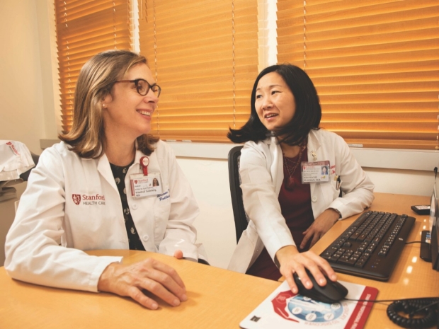 WINNIE TEUTEBERG, MD (left), and STEPHANIE HARMAN, MD, discuss the difficult conversations project
