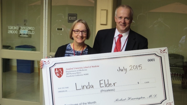 Linda Elder receives check