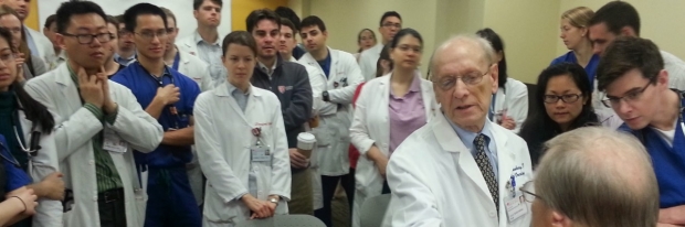 Saul Rosenberg demonstrates medical procedure to students at 2014 Stanford 25 session